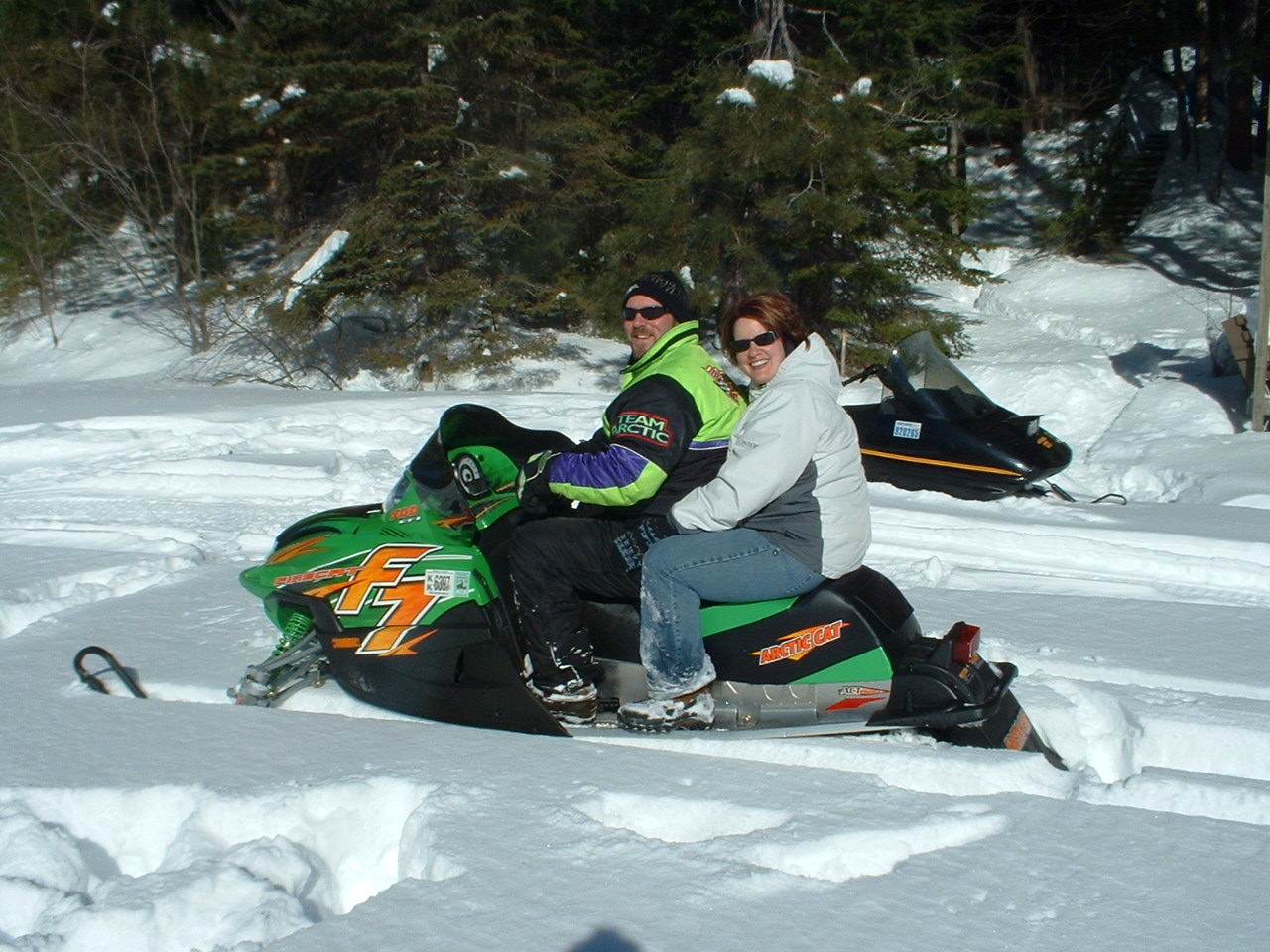 guests on their snowmobile